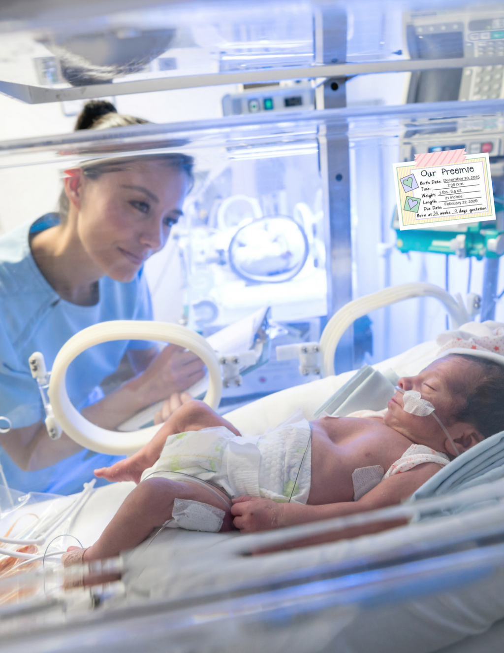 Nurse attending to a baby in an incubator with medical equipment in the background